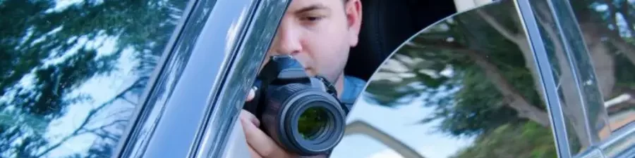 A Detective taking pictures of subject in Delhi.